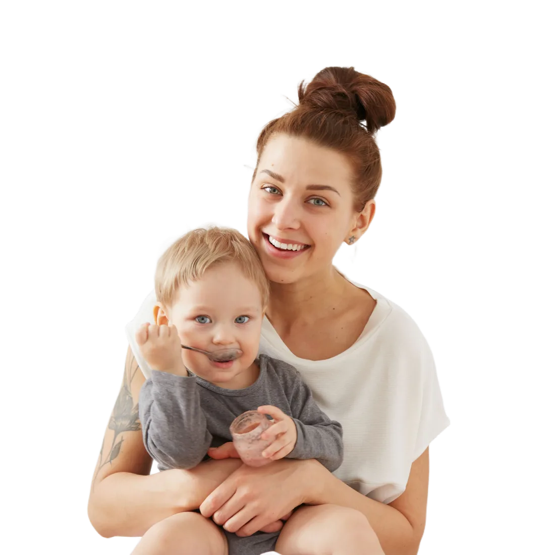 A mother laughing with her toddler on her hip